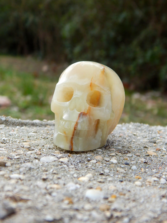 Banded calcite skull carving