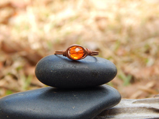 Orange glass and copper wire wrapped size 9.5 ring