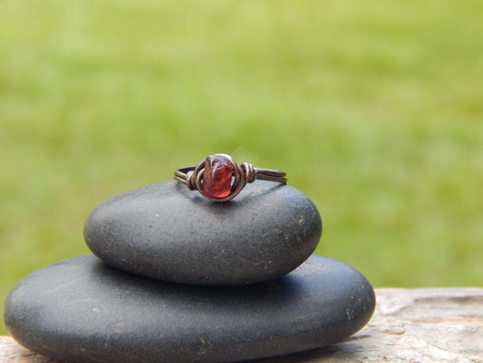 Copper wire wrapped garnet size 7.5 ring
